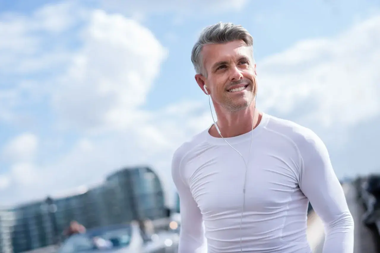 active man 50s outdoors smiling